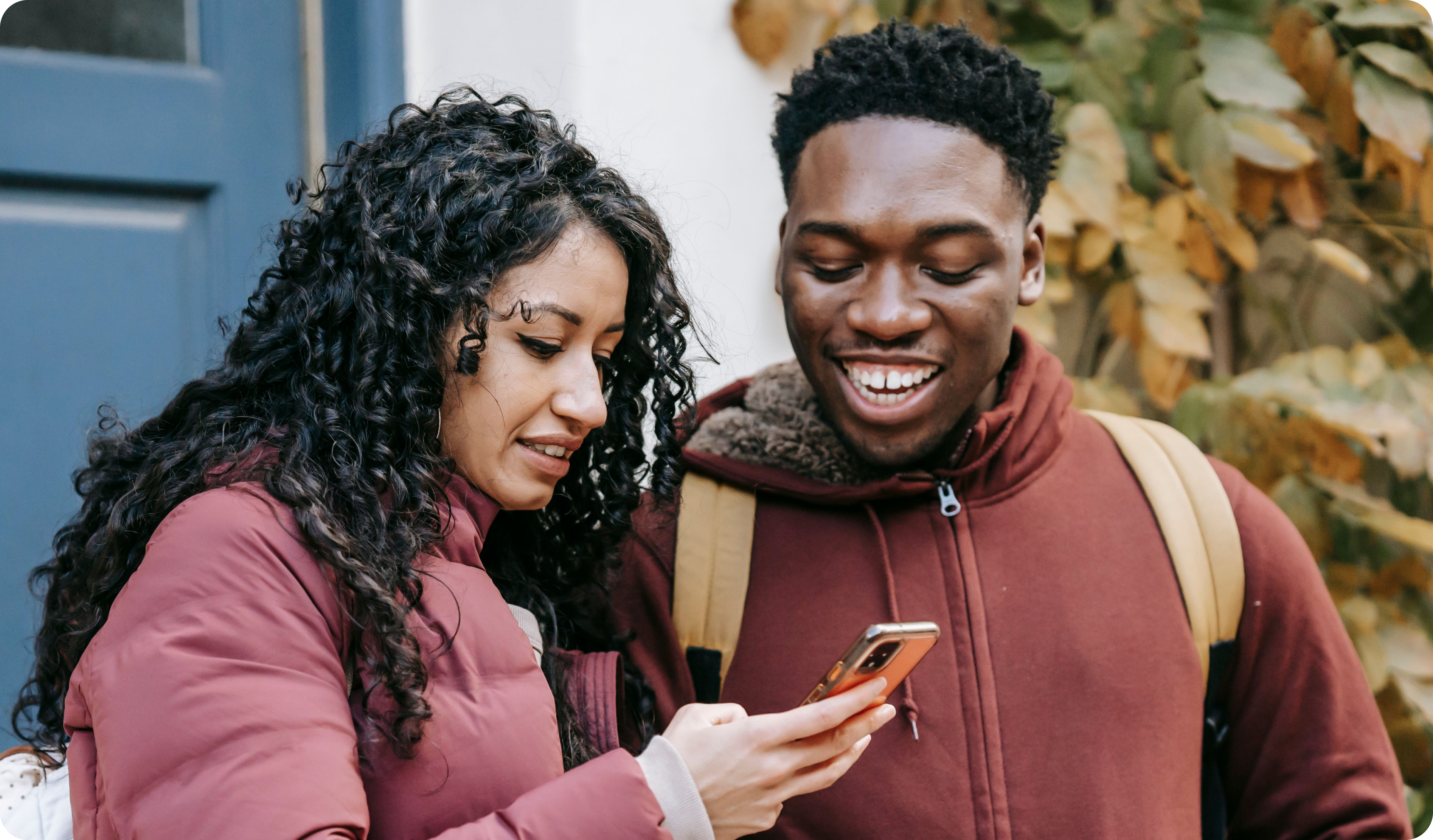 Two people looking at a phone together